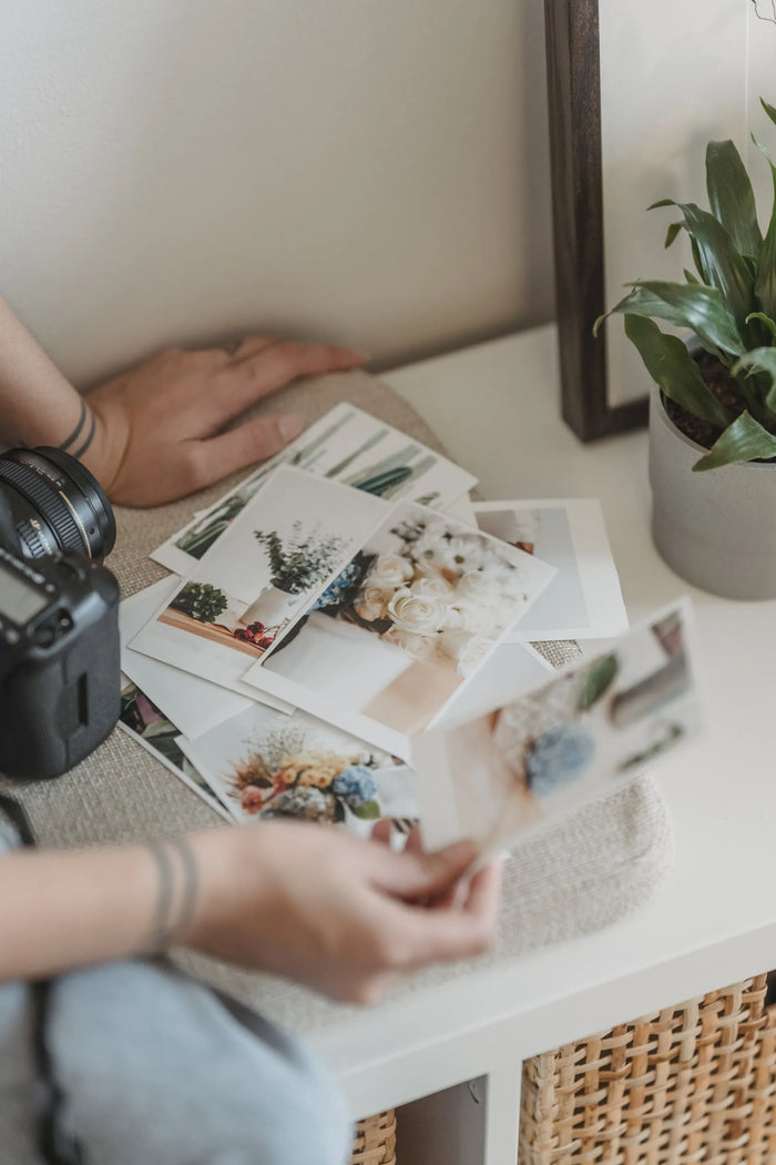 overhead photo of persons hands holding a printed photo