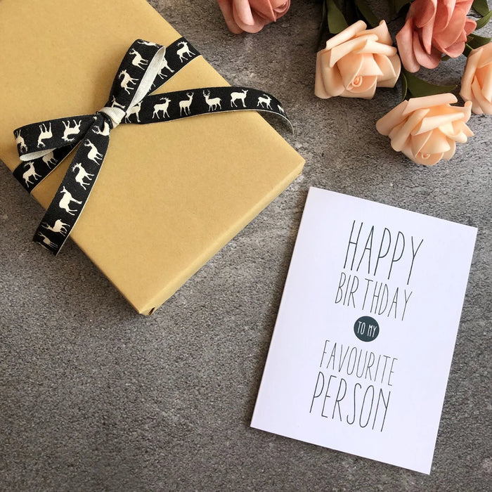 overhead photo of a birthday greeting card and gift
